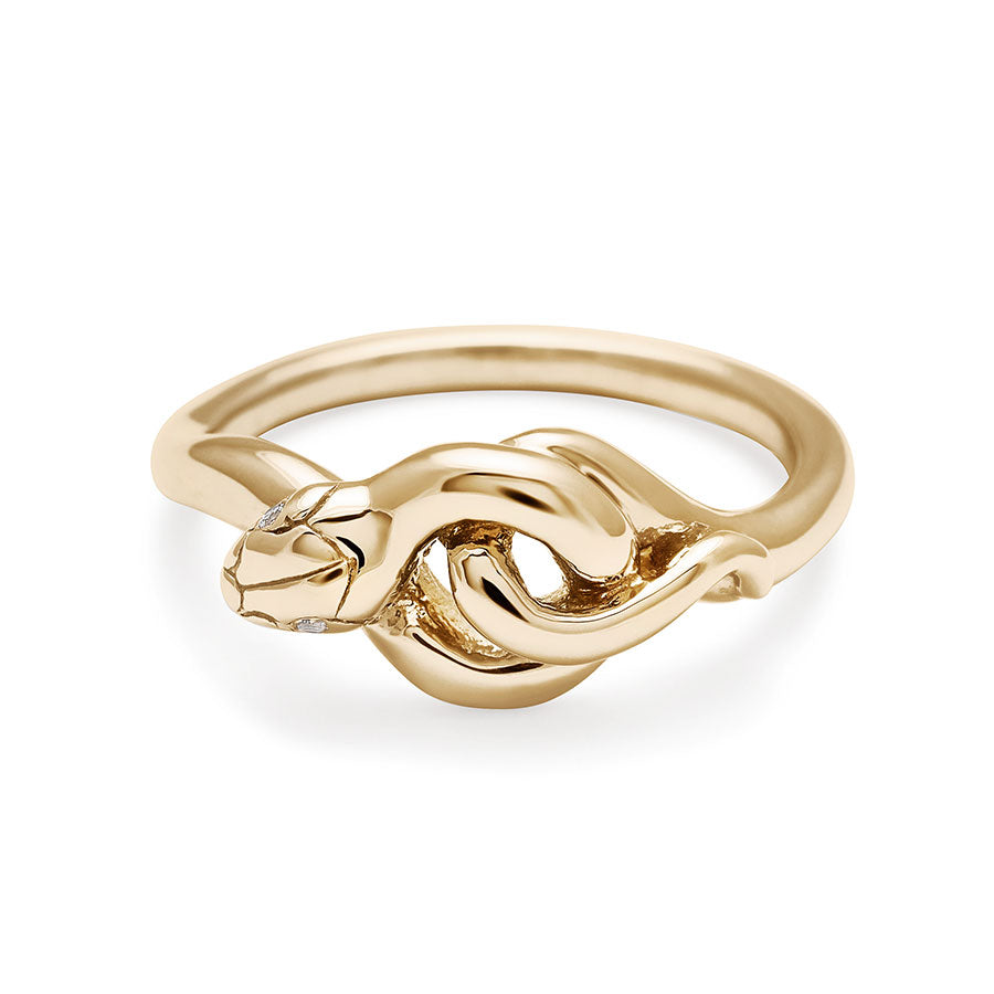 A yellow gold serpent band with white diamond eyes.