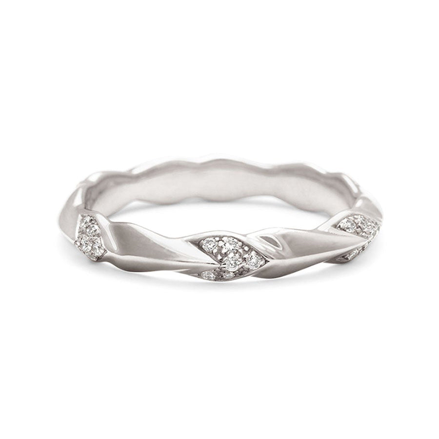 A straight band with leaf like definition with white diamond accents set in white gold.