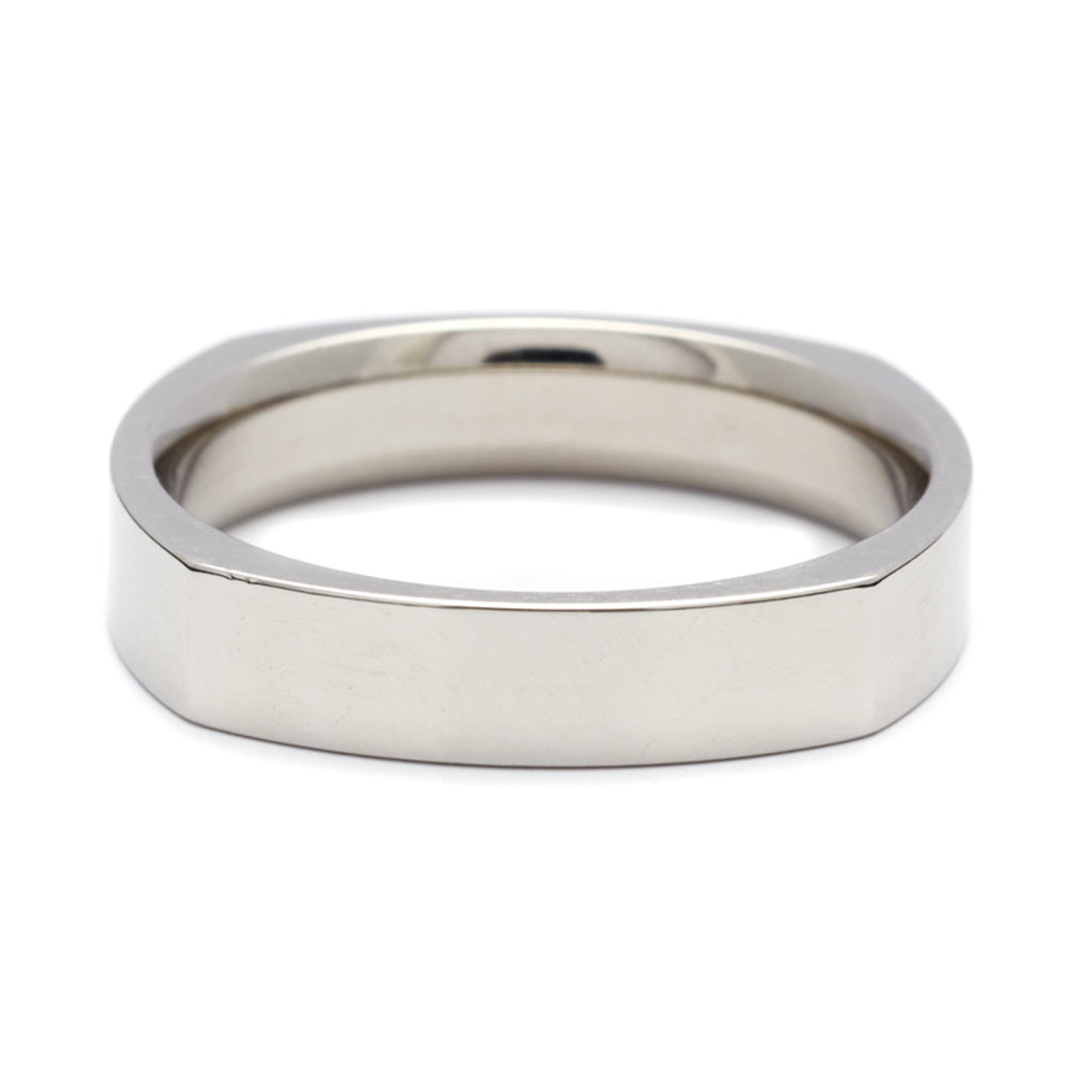 A soft square solid gold band set in white gold., White Gold