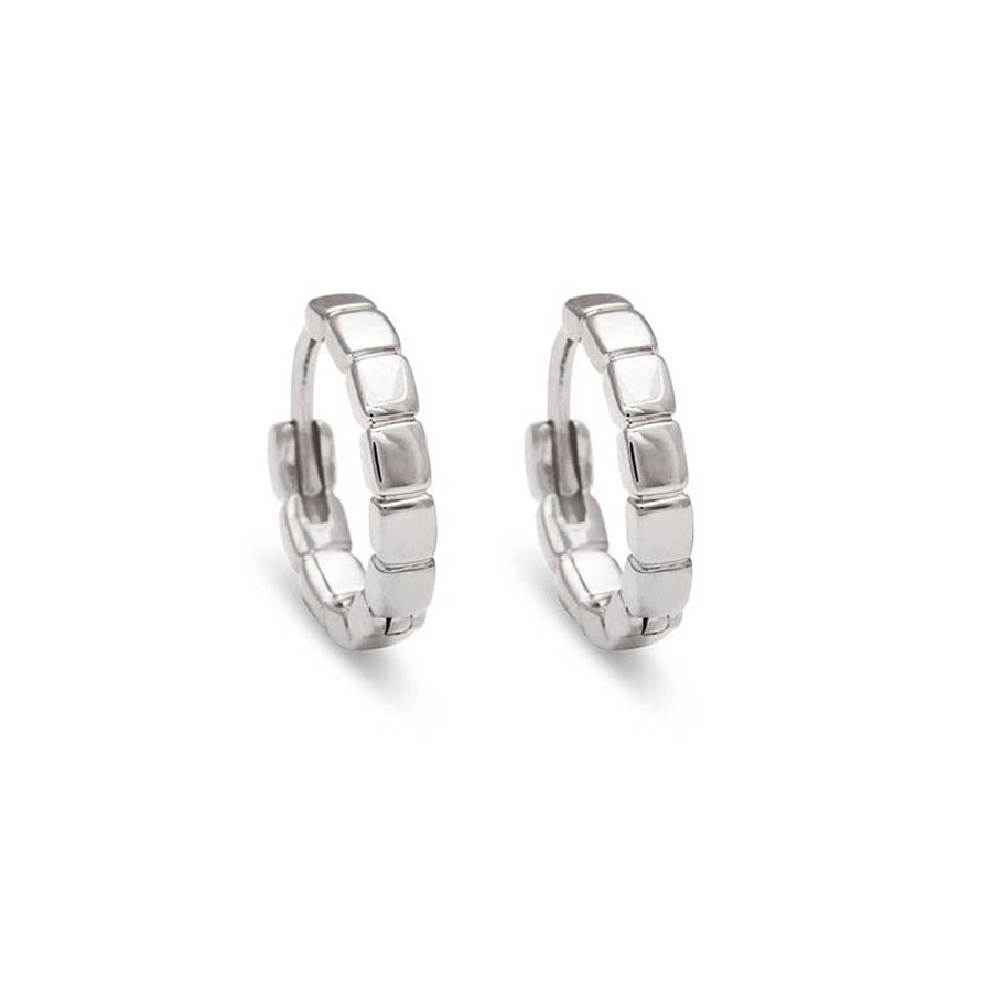 A solid gold pair of huggie hoops set in white gold., White Gold