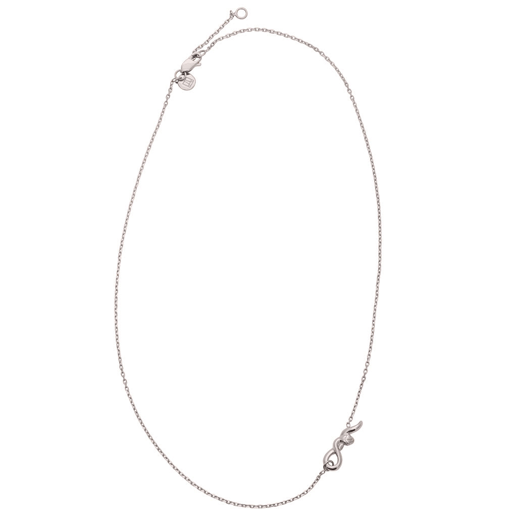 A zoomed out view of a choker with a medium serpent pendant with a white gold chain., White Gold