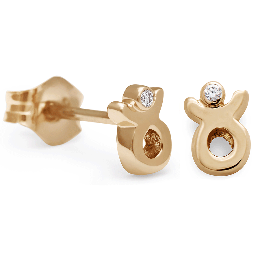 A pair of Taurus stud earrings set in yellow gold with a white diamond accent stone with one earring angled.
