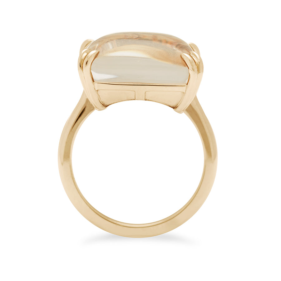 Side view of a square quartz solitaire ring set in yellow gold.
