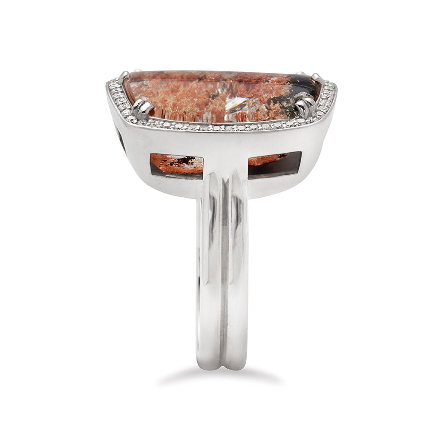 Side view of a square quartz surrounded by white diamond pave halo ring set in white gold.