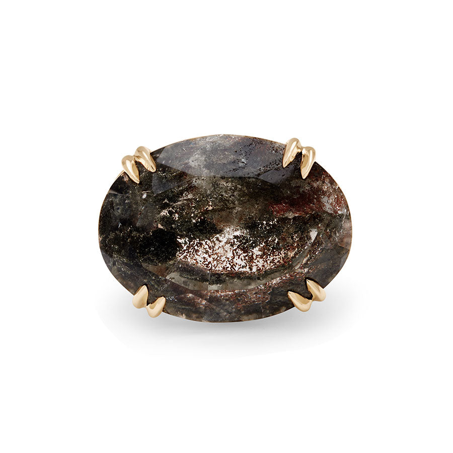 An oval east/west set quartz ring set in yellow gold with white diamonds surrounding the underneath of the stone and band.