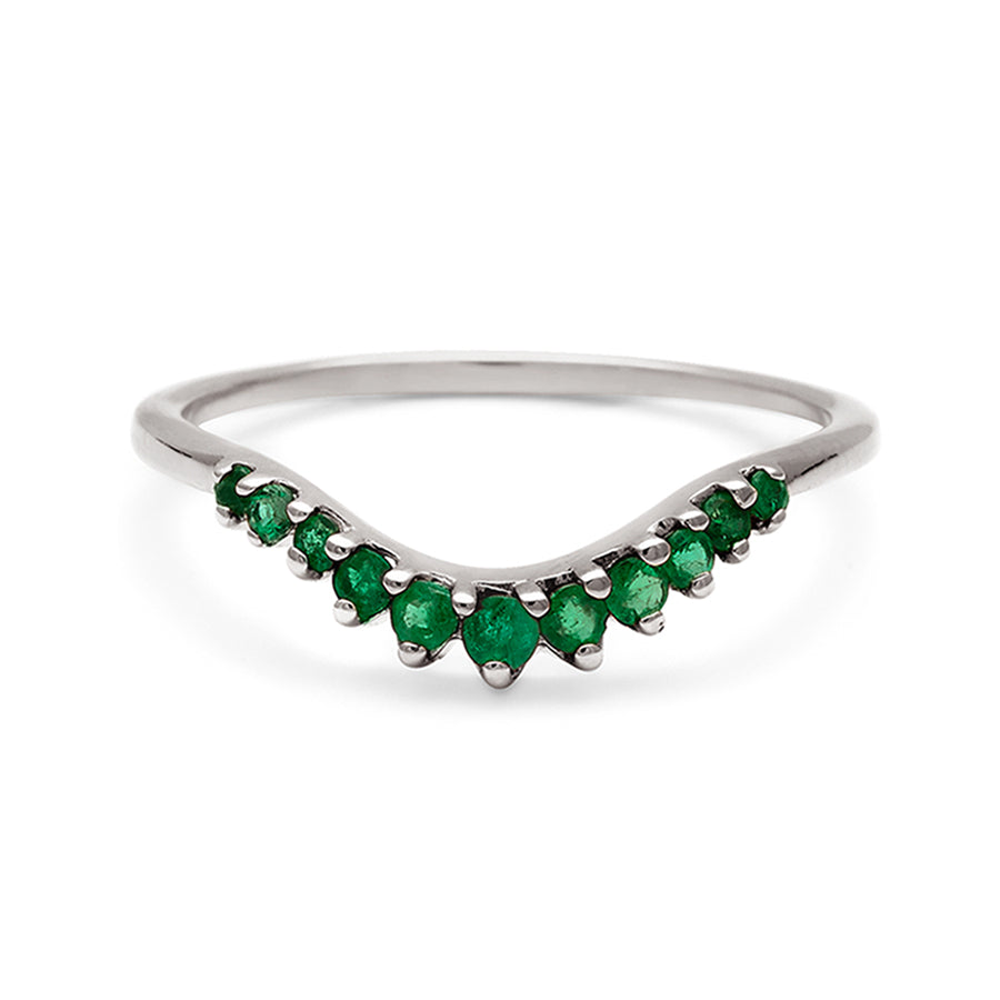 A curved 11 emerald band set in white gold., White Gold