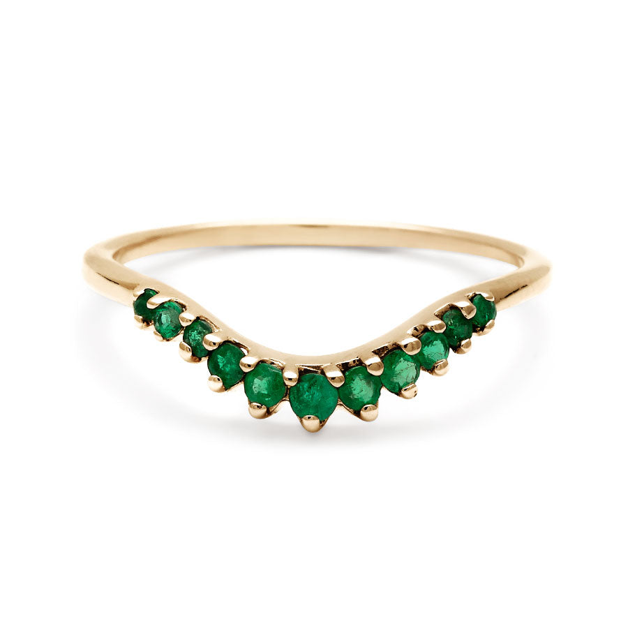 A curved 11 emerald band set in yellow gold., Yellow Gold