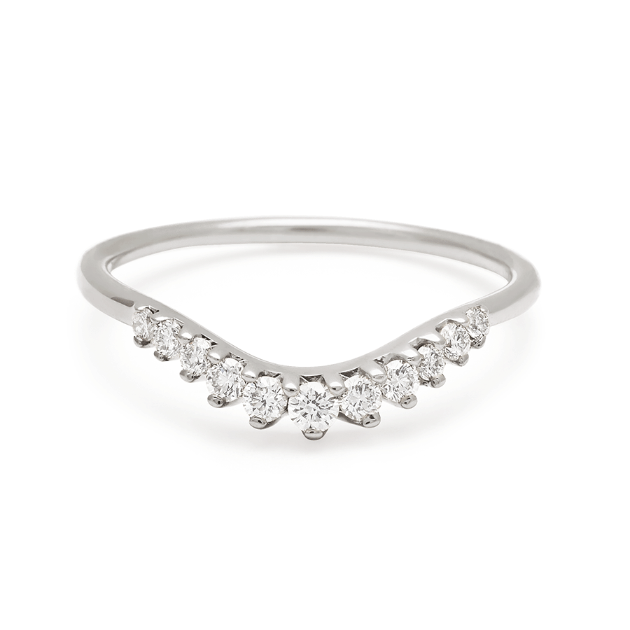 A curved 11 white diamond band set in white gold., White Gold