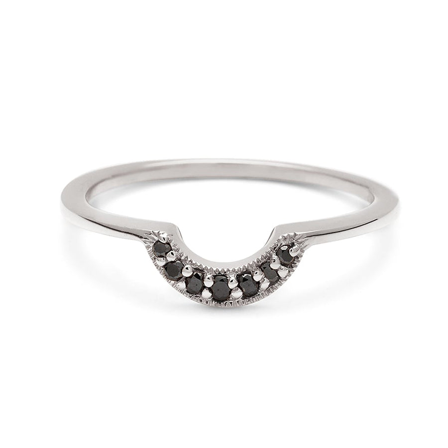 A tiny crescent shaped band with black diamonds set in white gold., White Gold