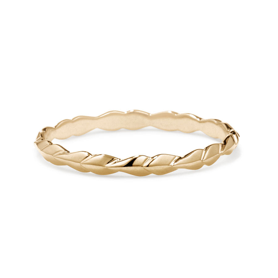 A tiny straight band with leaf like definition set in yellow gold., Yellow Gold