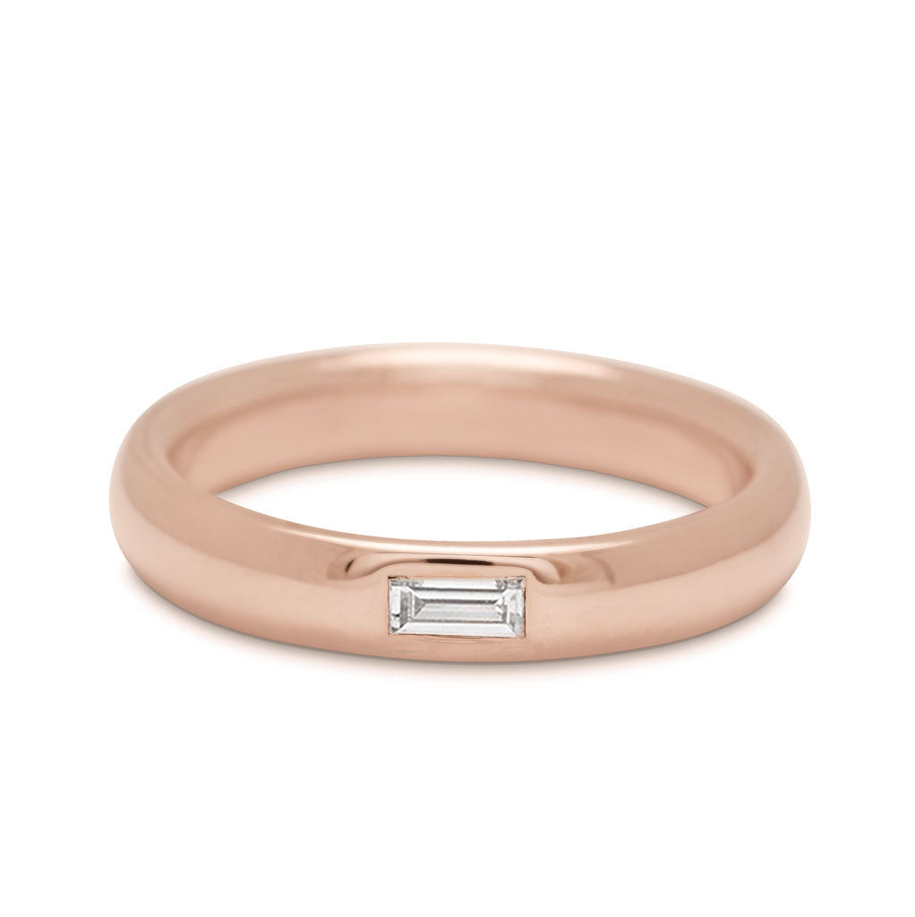 A 4mm classic round band with a white diamond baguette set in rose gold.