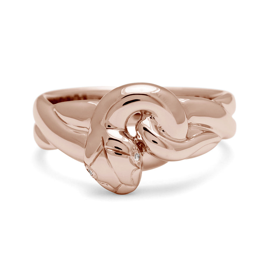 A large serpent band with white diamonds for eyes set in rose gold., Rose Gold