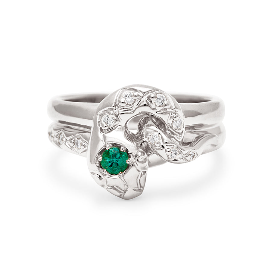 A serpent band with a green emerald center stone and white diamond accent stones around the head of the snake set in white gold., White Gold