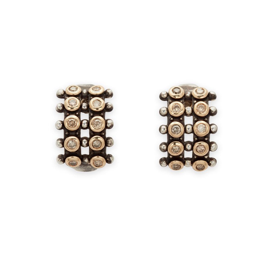 A pair of hoops with two lines of champagne diamonds set in sterling silver.