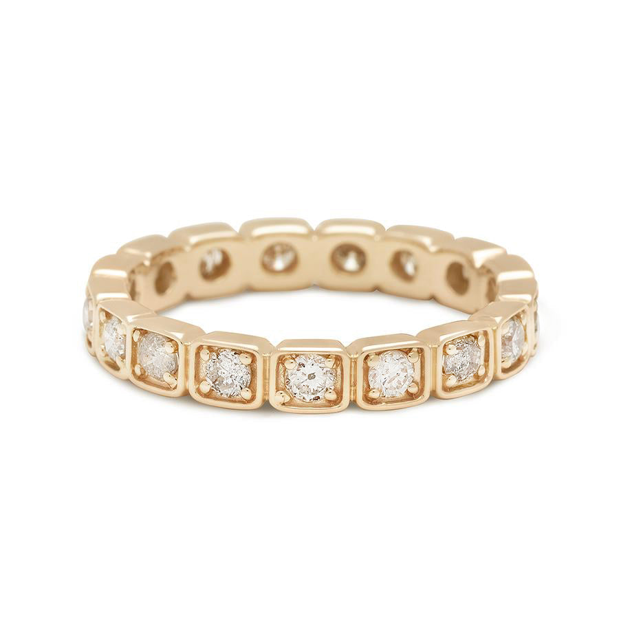 A 3mm white diamond eternity band set in yellow gold.