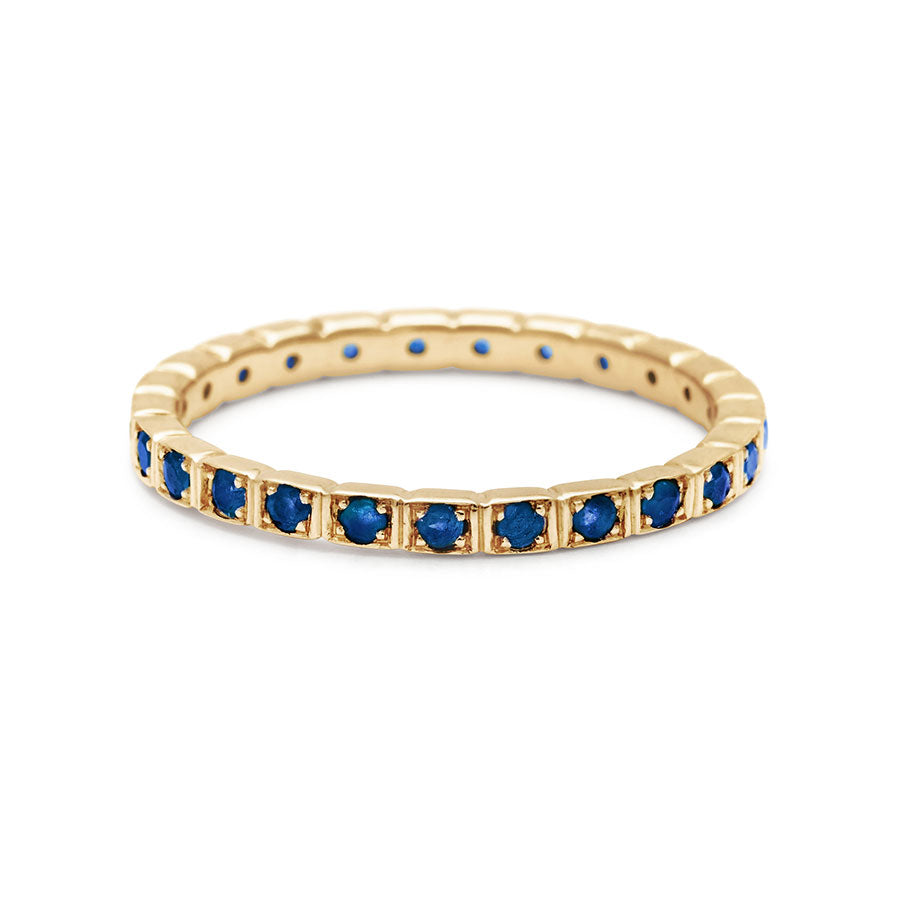A straight band with blue sapphires set in eternity around the band set in yellow gold., Yellow Gold
