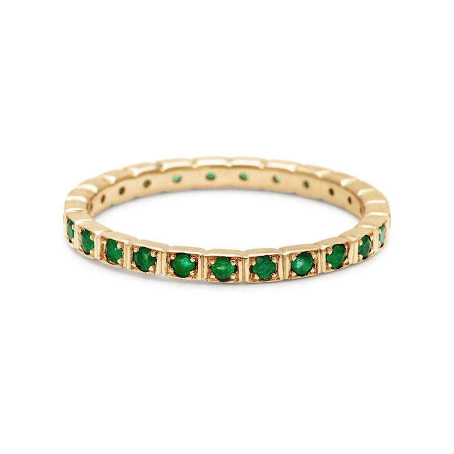 A straight band with emeralds set in eternity around the band set in yellow gold., Yellow Gold