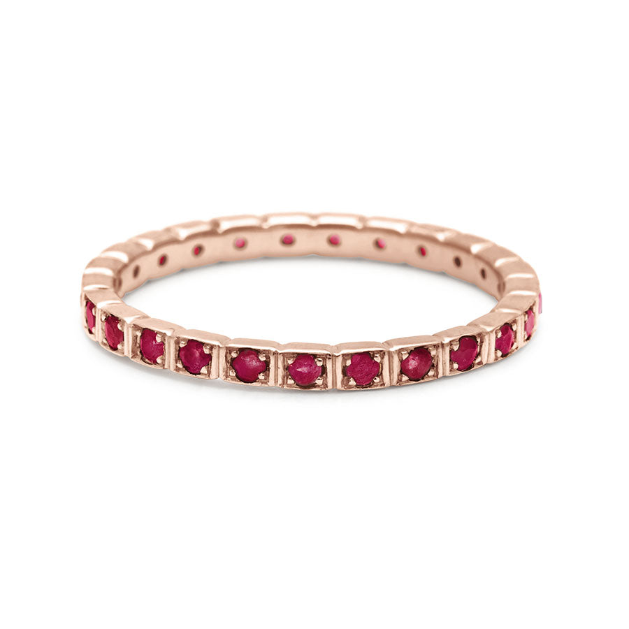 A straight band with rubies set in eternity around the band set in rose gold., Rose Gold