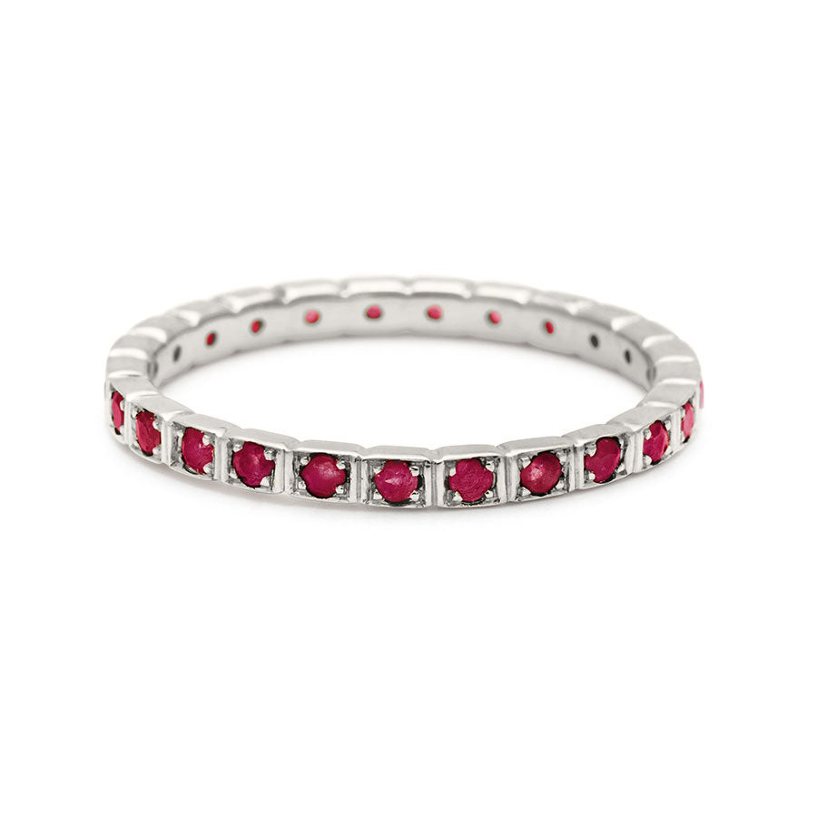 A straight band with rubies set in eternity around the band set in white gold., White Gold