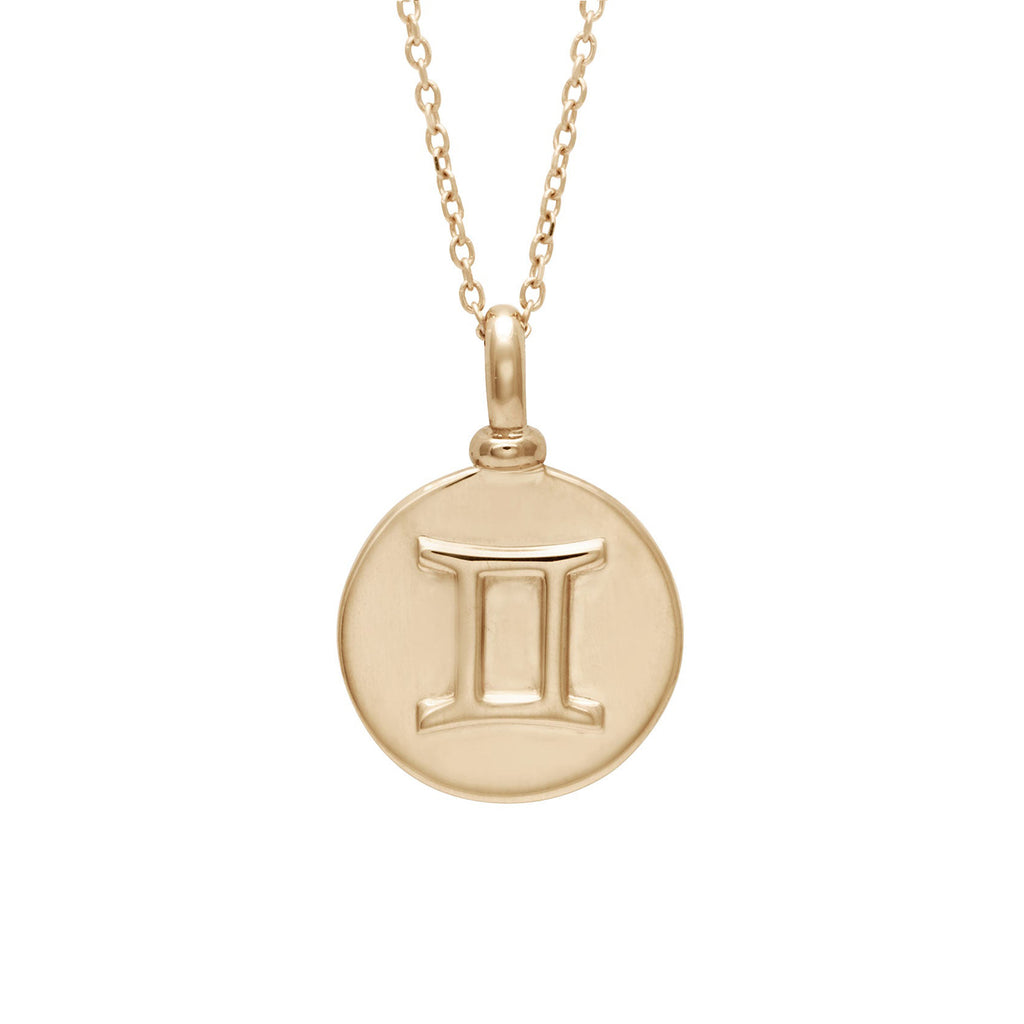 A 14mm charm with the Gemini zodiac sign set in yellow gold on a yellow gold chain.