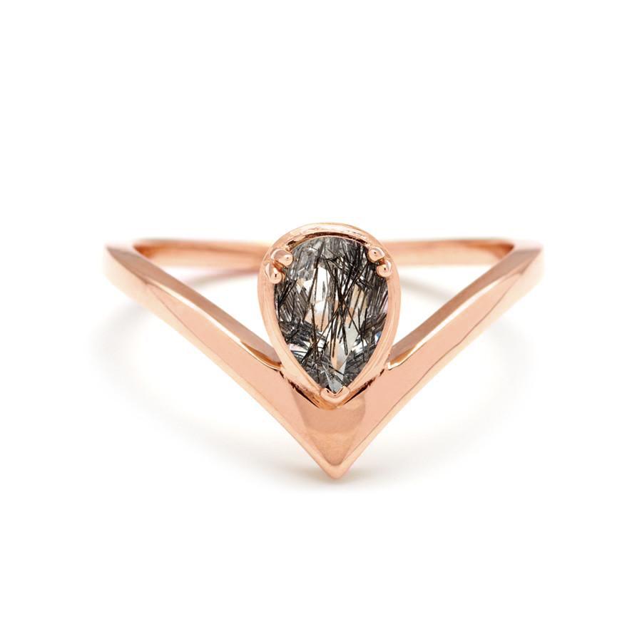 A pear shaped ring with a black rutilated quartz center stone set in rose gold., Rose Gold