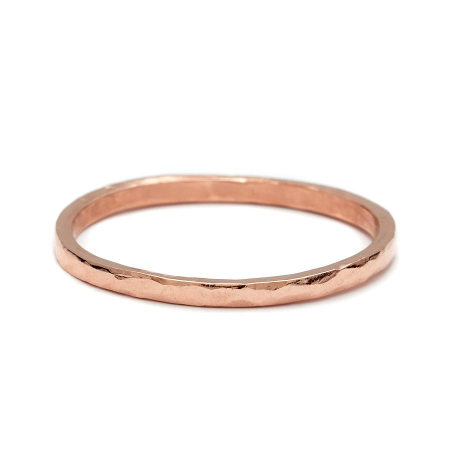 A 1.5mm flat band with a hammered finished set in rose gold., Rose Gold