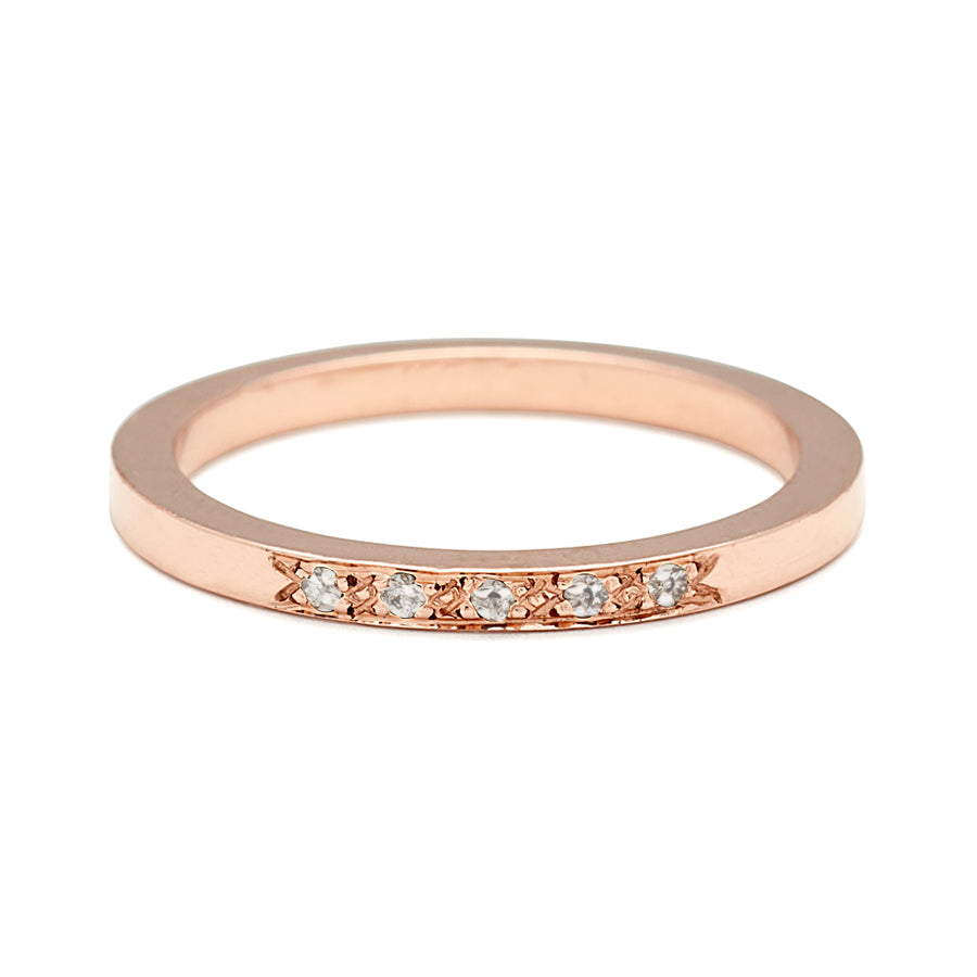 A flat band with 5 white diamonds set in the center in rose gold., Rose Gold