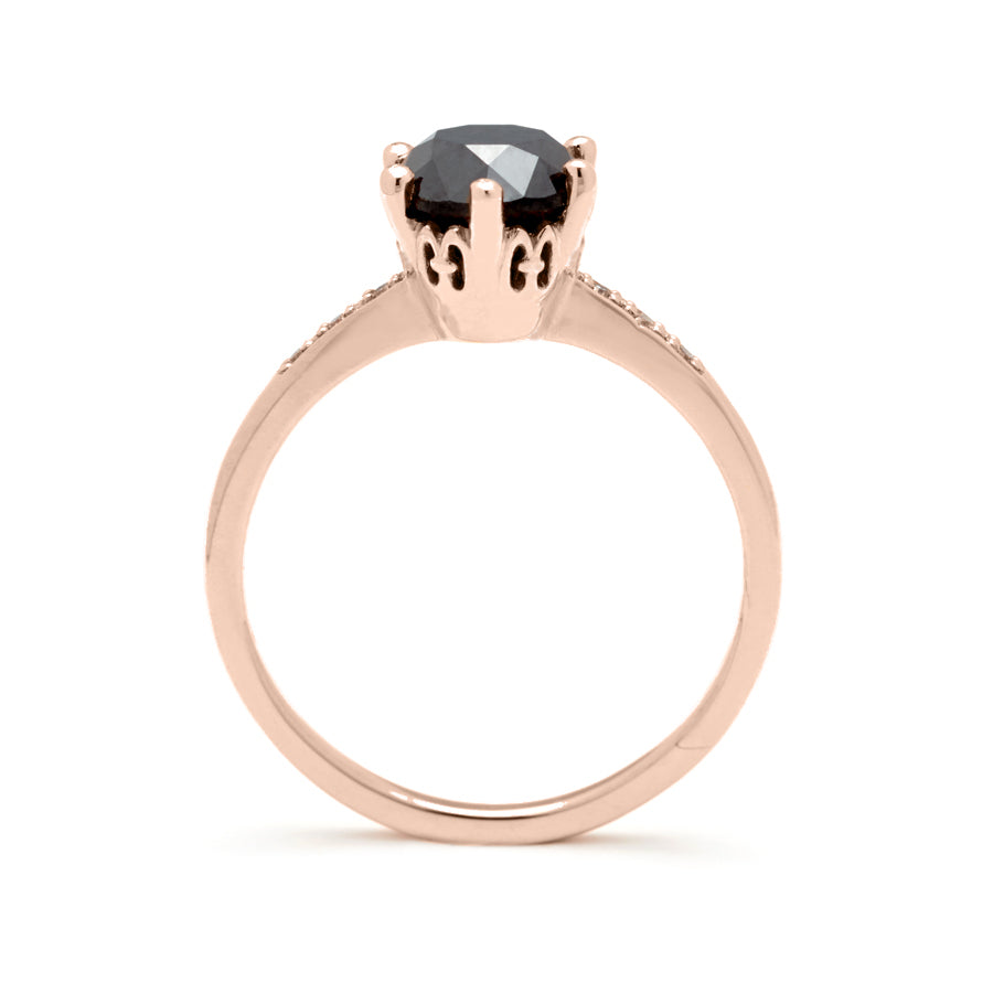 Side view of a solitaire ring with a round 1.00ct black diamond with white diamond pave on either side set in rose gold., Rose Gold