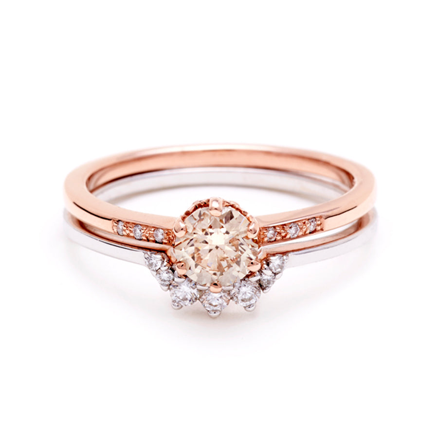 A solitaire ring with a round 0.50ct champagne diamond with white diamond pave on either side set in rose gold stacked on top of a 7 white diamond curve band set in white gold., Rose Gold, Yellow Gold