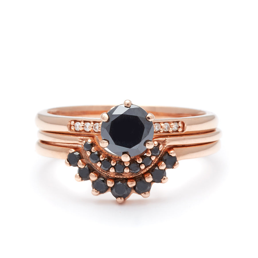 A solitaire ring with a round 0.50ct black diamond with white diamond pave on either side set in rose gold set above two black diamond curve bands., White Gold, Rose Gold, Yellow Gold