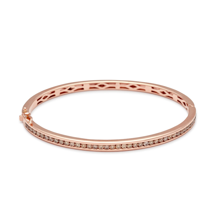 A bracelet with a line of champagne diamonds set around the band set in rose gold., Rose Gold