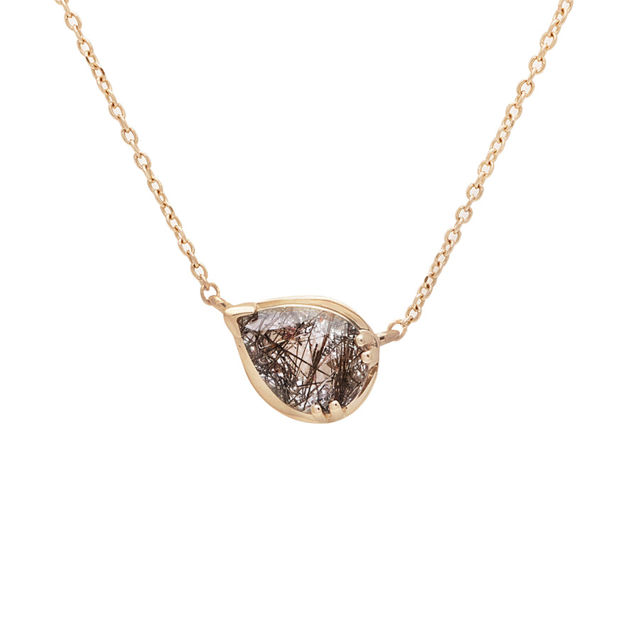 A necklace with a pear pendant with a black rutilated quartz set in yellow gold with a yellow gold chain.