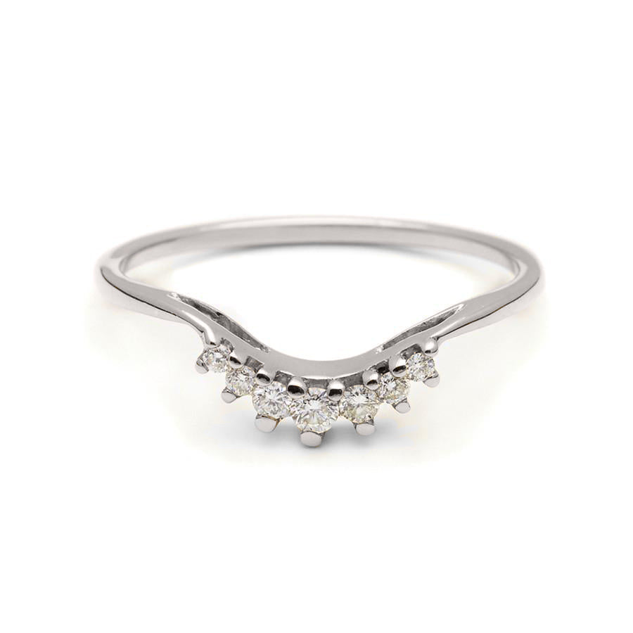 A curved band with 7 white diamonds in ascending and descending size set in white gold., White Gold