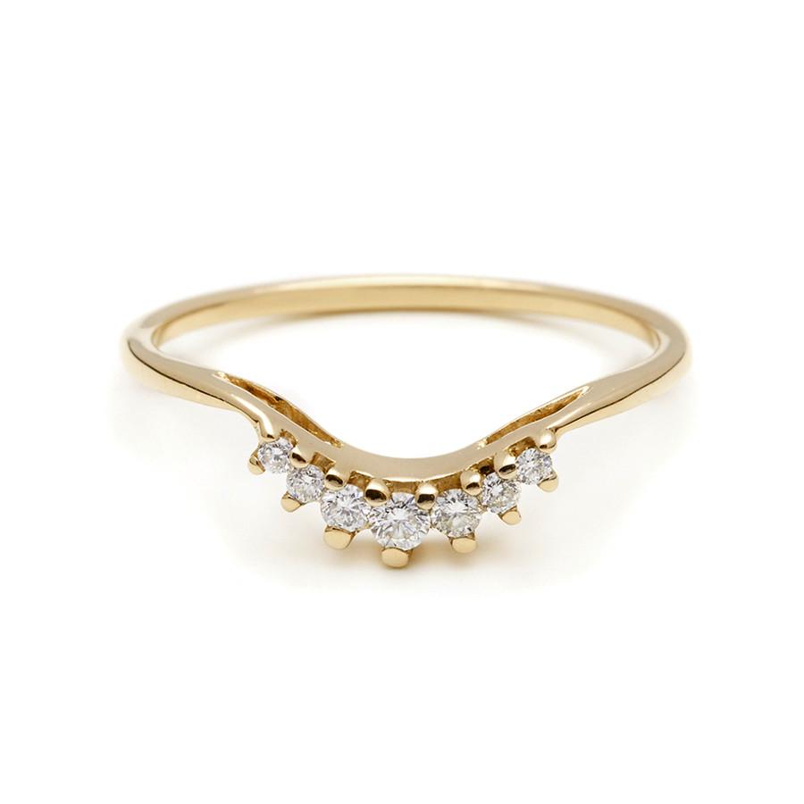 A curved band with 7 white diamonds in ascending and descending size set in yellow gold., Yellow Gold