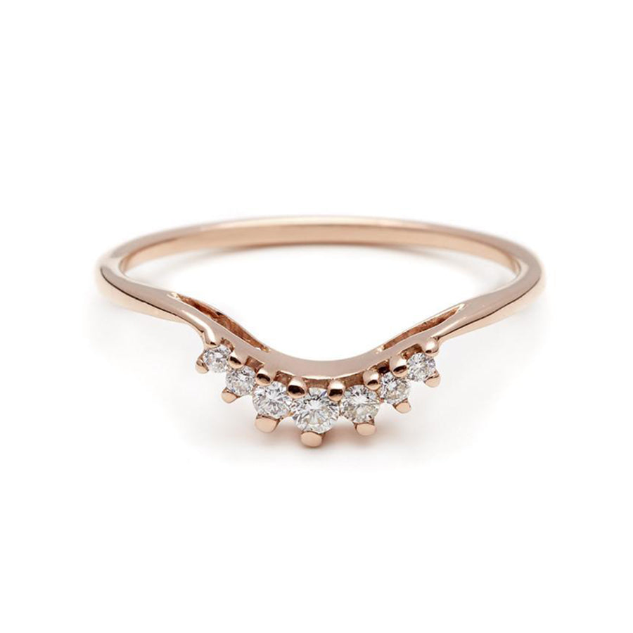 A curved band with 7 white diamonds in ascending and descending size set in rose gold., Rose Gold