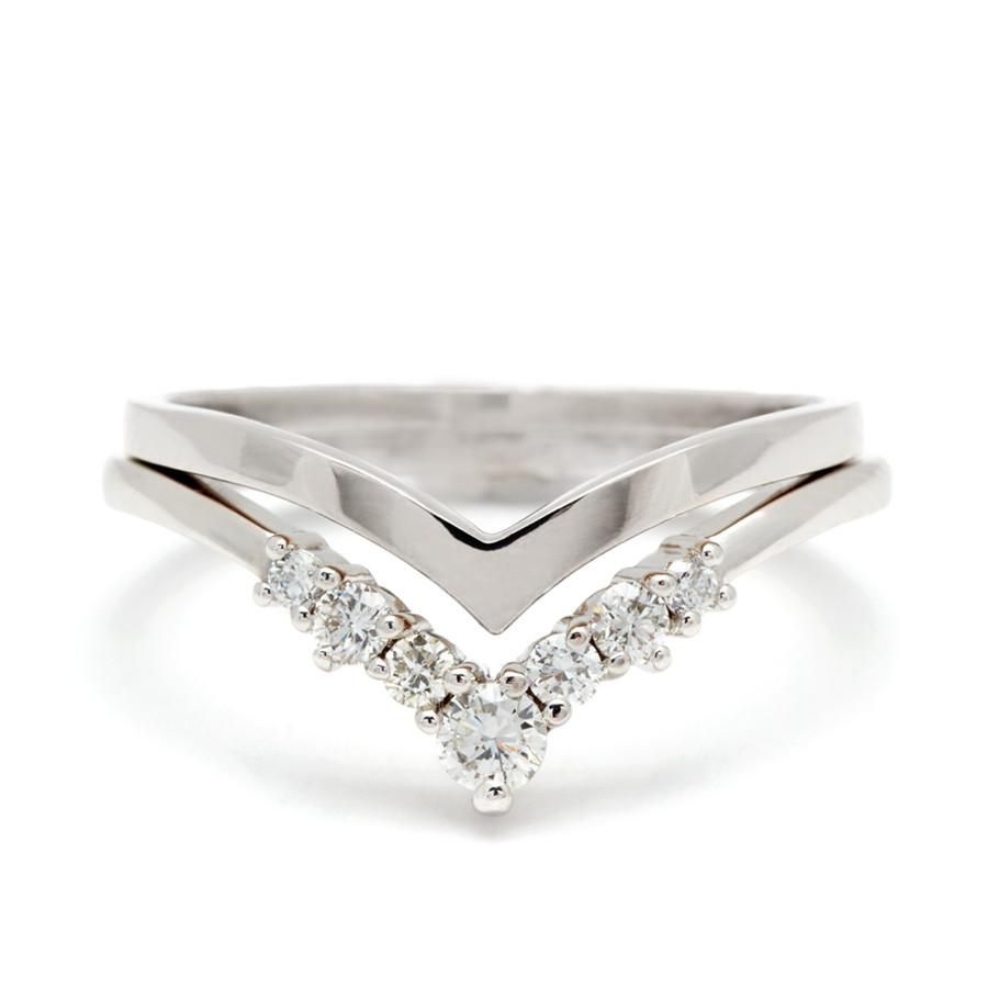 A pointed shape in solid gold stacked above an ascending size white diamond nesting band both in white gold. Available in Yellow Gold, Rose Gold, White Gold.