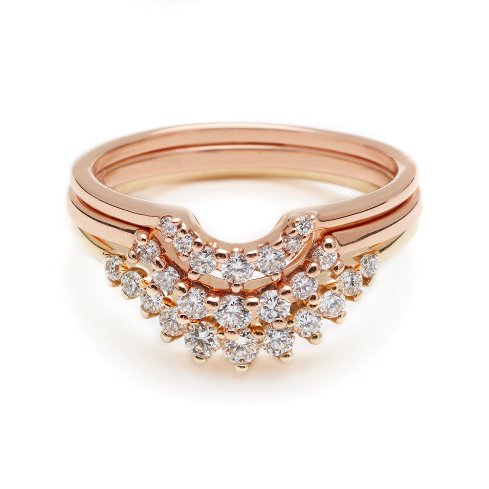 Three curve bands with white diamonds two in rose gold and one in yellow gold.
