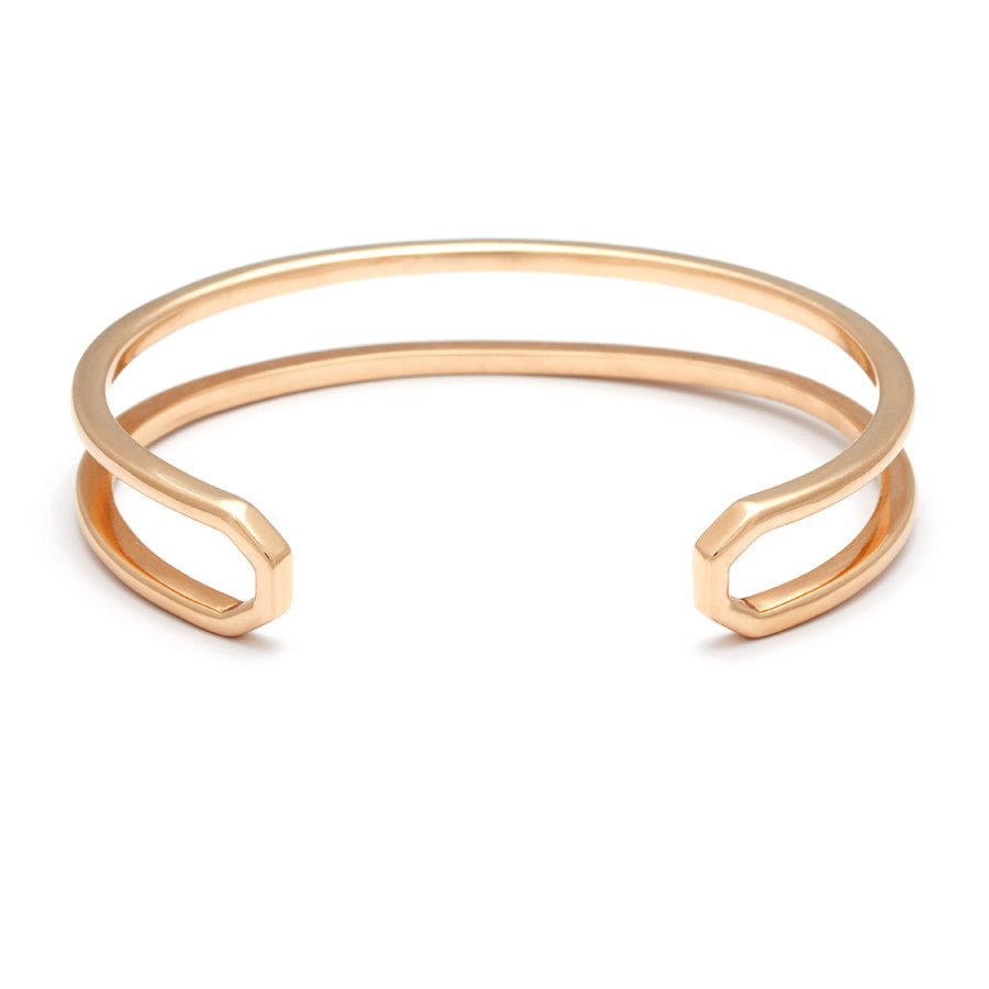 Upside down view of a doubled banded cuff bracelet set in yellow gold.