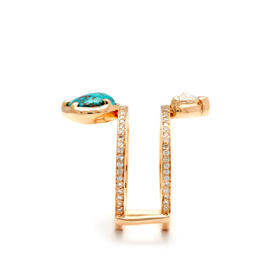 Side view of a pair of medium pearl center stone earrings with a halo of white diamond set in yellow gold.