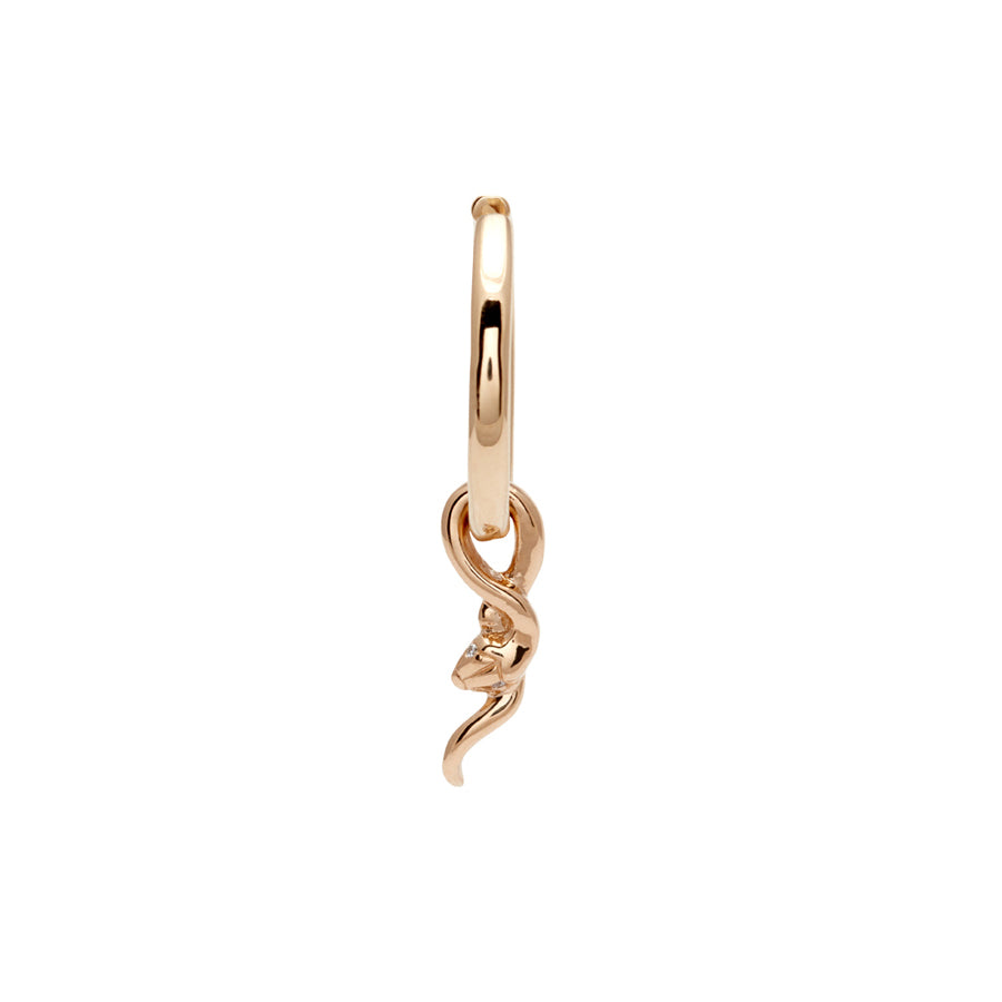 A single hoop earring with a serpent charm at the bottom set in yellow gold.