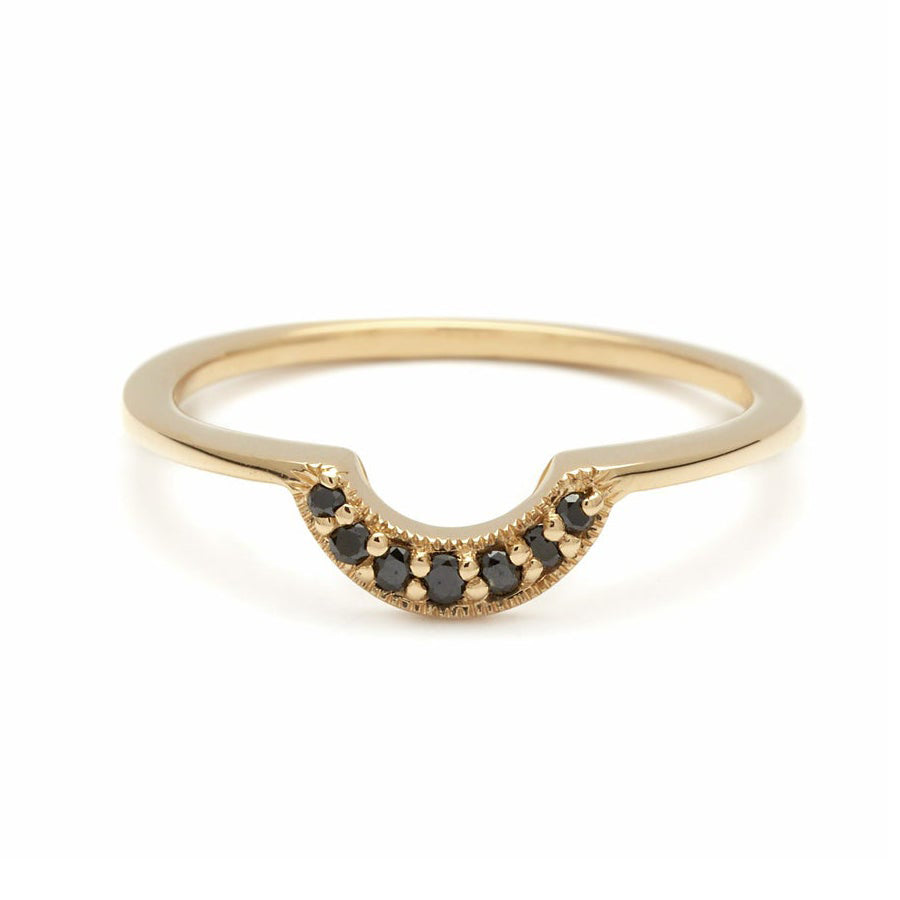 A tiny crescent shaped band with black diamonds set in yellow gold., Yellow Gold