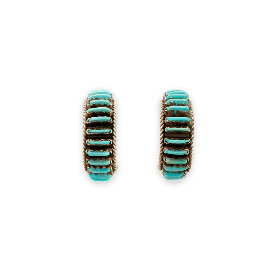 A pair of turquoise hoops set in sterling silver.