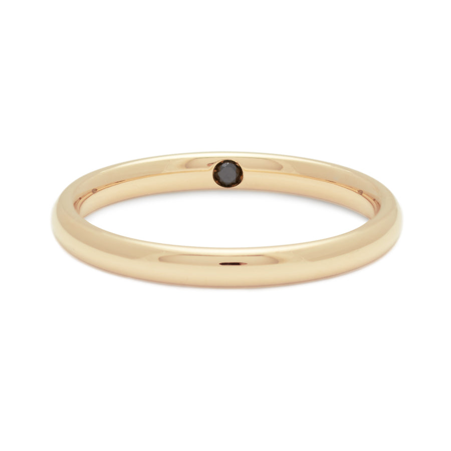 A 2mm classic round band set in yellow gold with a hidden black diamond.